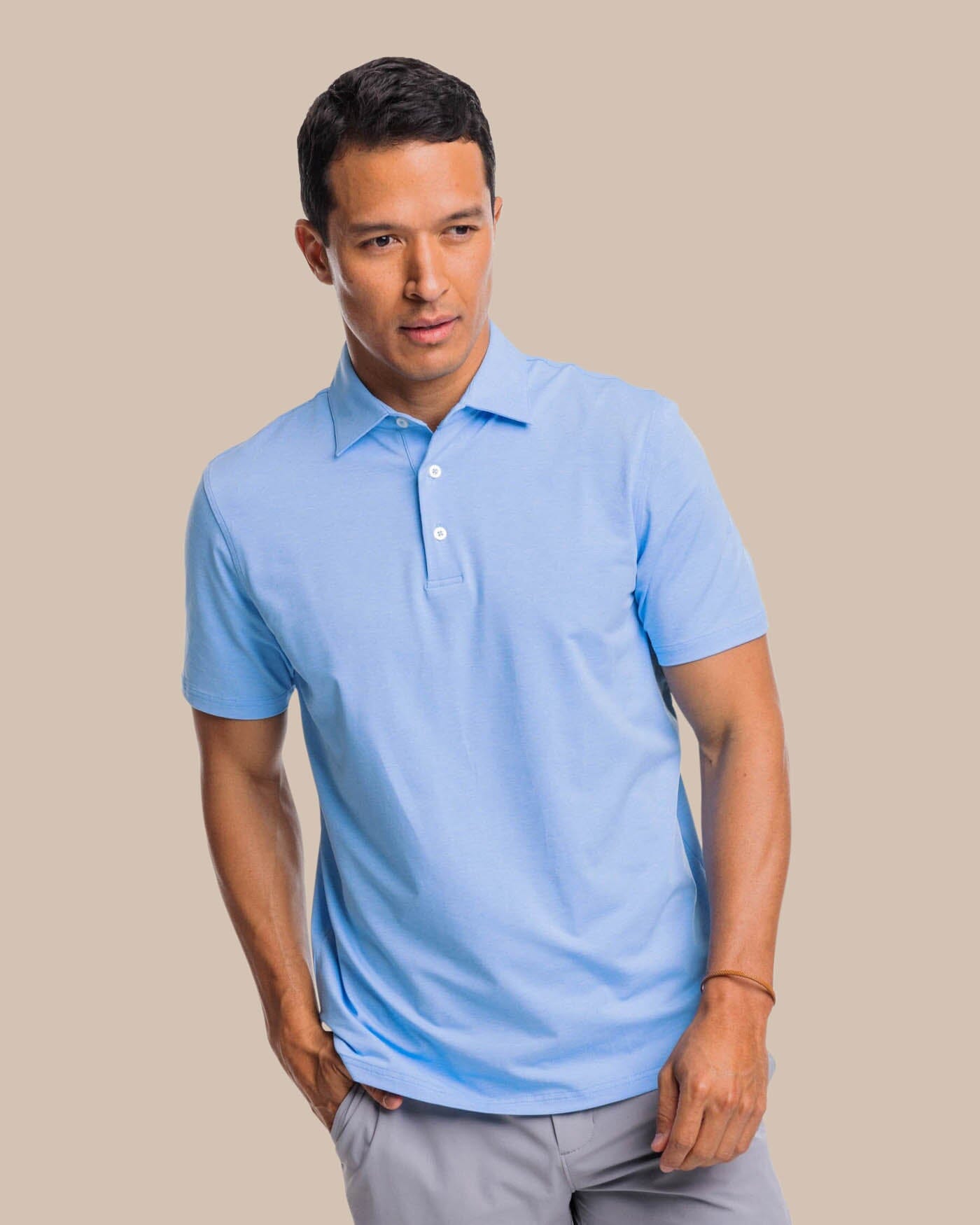 The front view of the brrr掳庐-eeze Heather Performance Polo Shirt by Southern Tide - Heather Ocean Channel