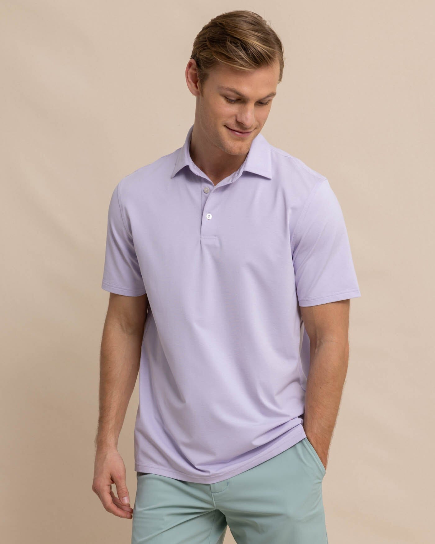 The front view of the Southern Tide brrr eeze Heather Performance Polo Shirt by Southern Tide - Heather Orchid Petal